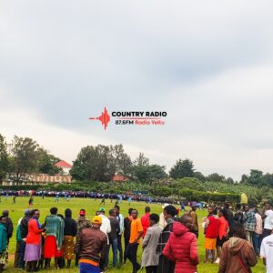 Country Radio 87.6 FM listeners cheering on the radio staff during a football match.