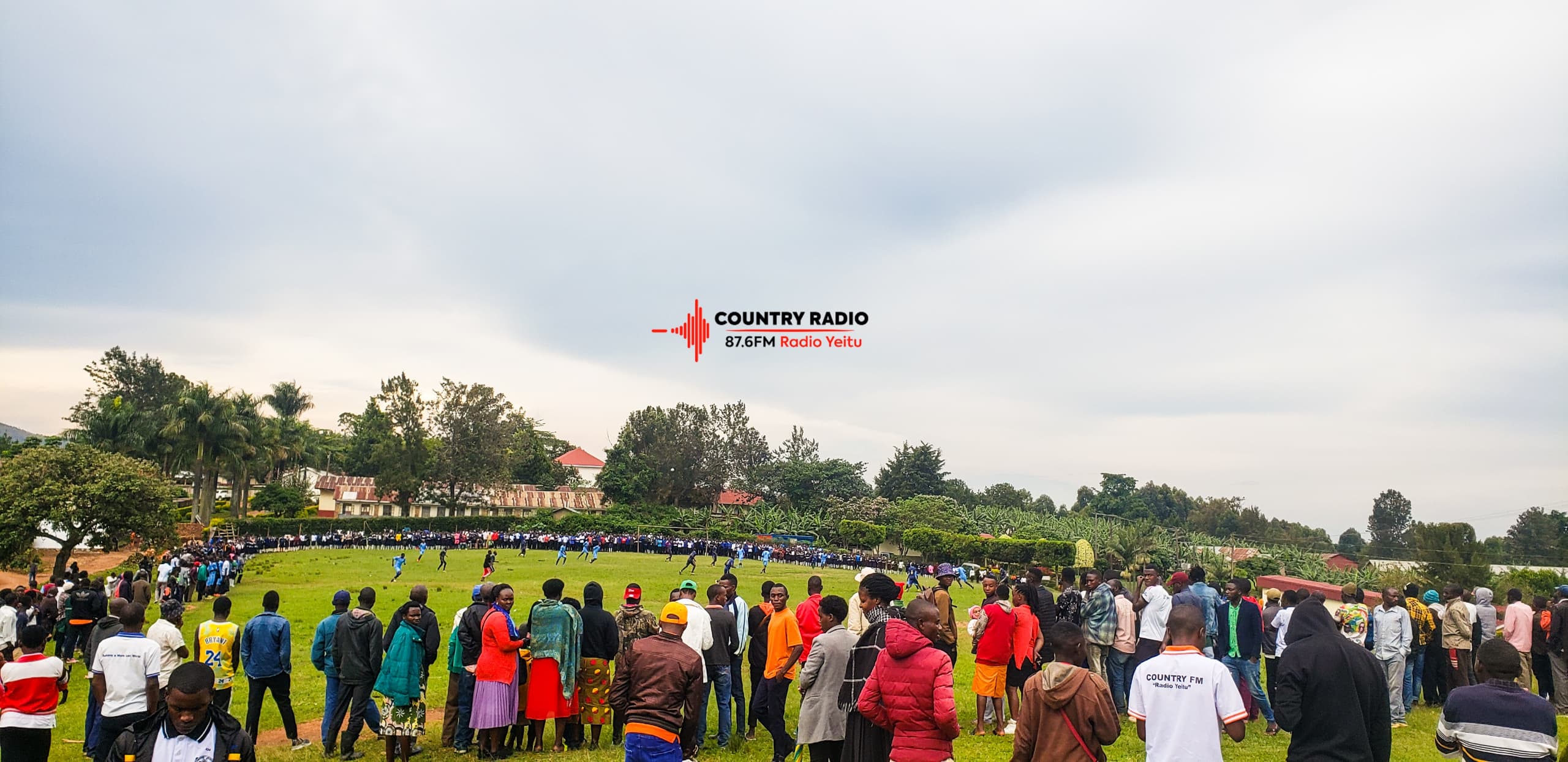 Country Radio 87.6 FM listeners cheering on the radio staff during a football match.